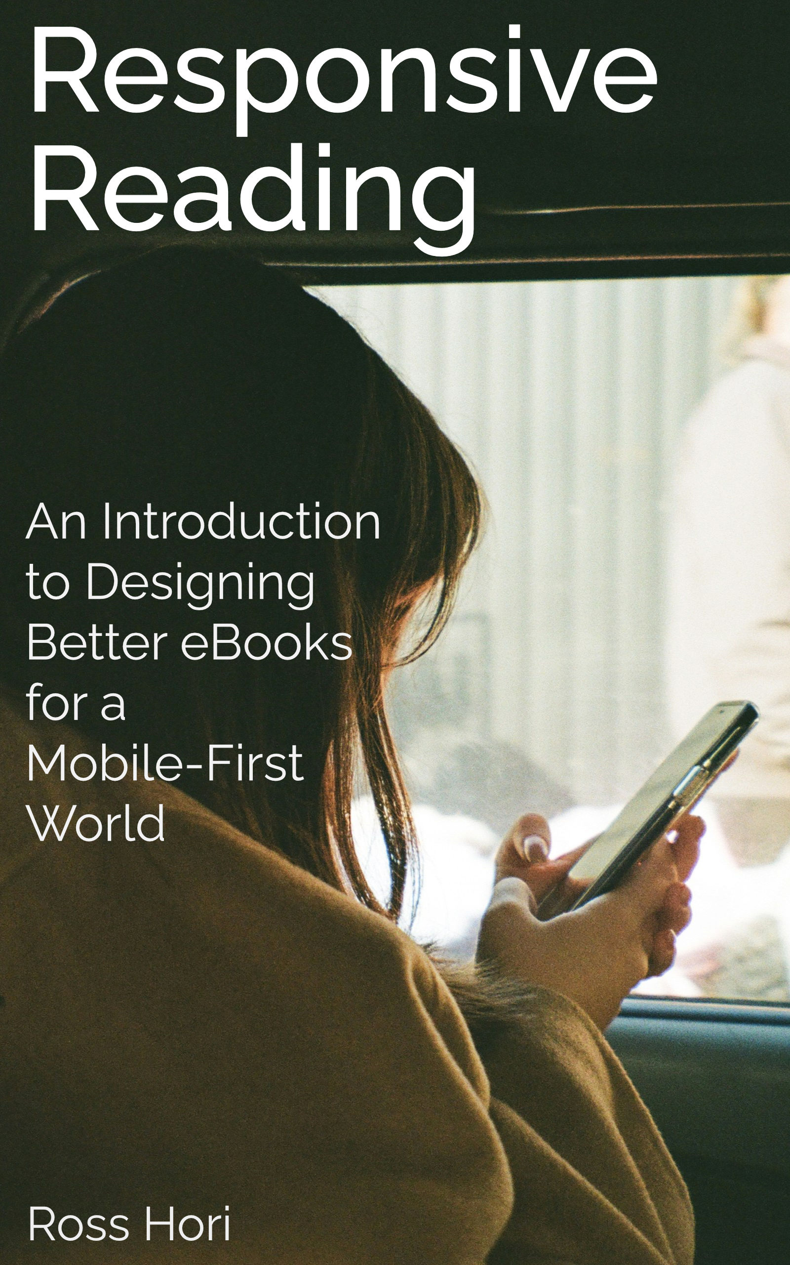 A person looking out of a window with an eReader in hand.